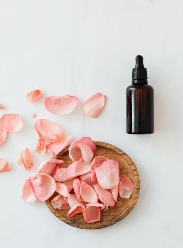 A bottle of face serum with goodness of rose petals